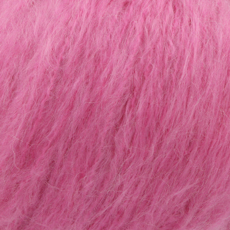 A close-up texture shot of fluffy, soft pink hair fibers, likely mohair or a similar high-pile wool blend.