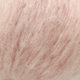 A close-up texture shot of fluffy, soft yarn filling the entire frame.