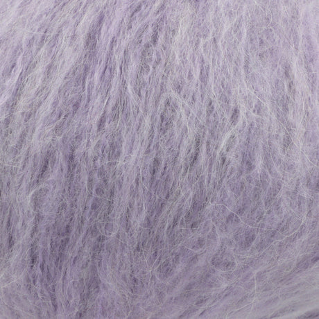A close-up texture shot of fluffy, shaggy lavender-purple yarn, showing the fine strands and soft, fuzzy surface.