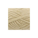 A close-up of thick, plush chenille yarn strands in a warm cream or light beige colour, arranged in a textured spiral pattern on a plain white background.
