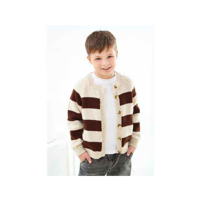 A young boy wearing a brown and cream striped knit cardigan over a white t-shirt and gray jeans, standing against a bright white background.
