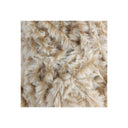 A close-up of a shaggy faux fur or sheepskin-like textile in warm beige and cream tones, centered on a white background.
