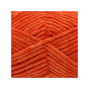 A close-up of bright orange fuzzy chenille arranged in a textured crisscross pattern, centred on a white background.