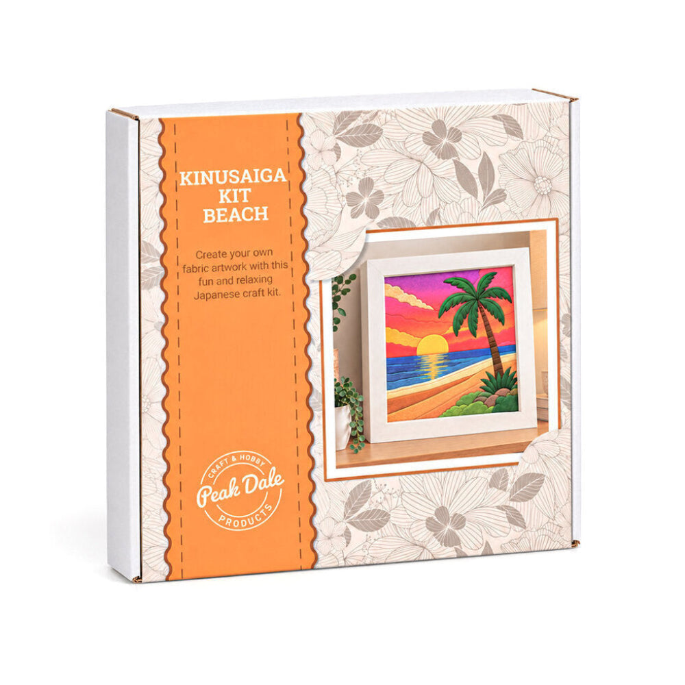 A boxed craft kit package labeled 'KINUSAIGA KIT BEACH' with an orange vertical panel and a floral cream background. A small preview of a colorful beach sunset artwork is shown on the front, and the Peak Dale Products logo appears near the bottom.