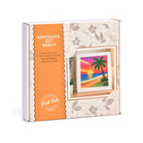 A boxed craft kit package labeled 'KINUSAIGA KIT BEACH' with an orange vertical panel and a floral cream background. A small preview of a colorful beach sunset artwork is shown on the front, and the Peak Dale Products logo appears near the bottom.