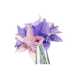 Three handmade origami paper flowers in shades of purple, pink, and white, arranged in a small clear glass vase against a plain white background.