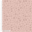 Floral patterned fabric with a ruler on the side on a pink background