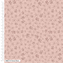 Floral patterned fabric with a ruler on the side on a pink background