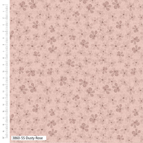 Floral patterned fabric with a ruler on the side on a pink background