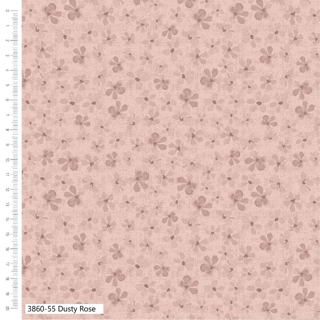 Floral patterned fabric with a ruler on the side on a pink background