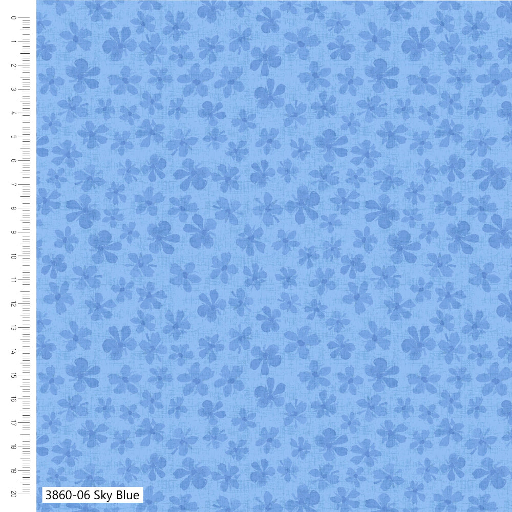 Blue fabric with floral pattern and ruler for scale