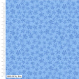 Blue fabric with floral pattern and ruler for scale