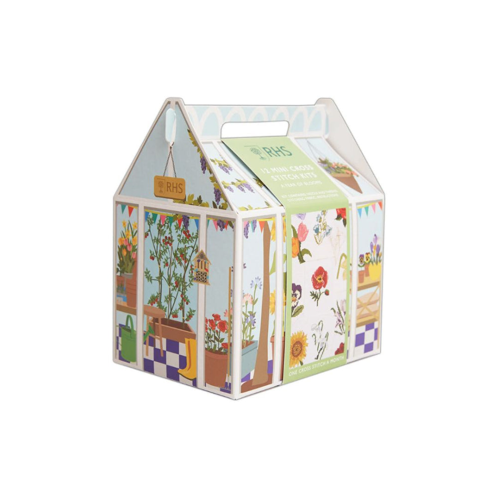 A house-shaped garden patch kit box with a handle, decorated with colorful illustrations of plants, flowers, and gardening tools on a white background.