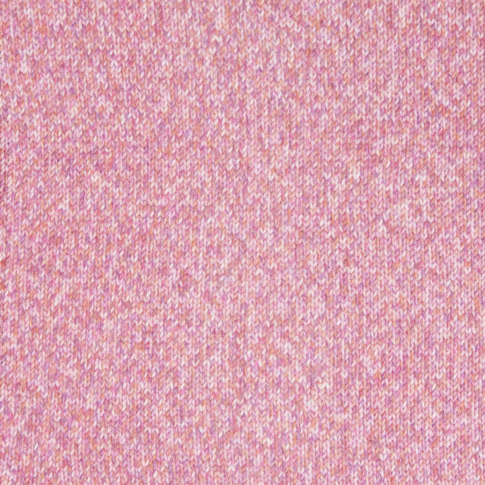 A close-up of a pink heathered knit fabric texture, showing the fine woven pattern.