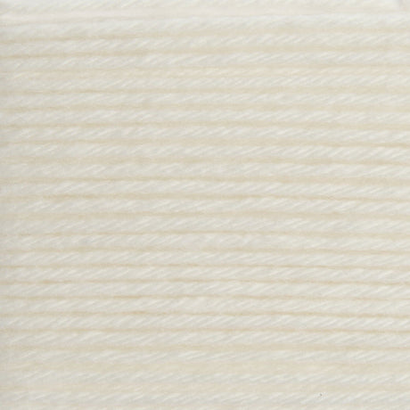 A close-up texture shot of cream-colored yarn wound horizontally, showing the fine twisted strands and soft, warm off-white color.