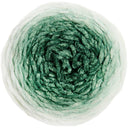 A single round skein of variegated yarn photographed from above on a plain white background. The yarn has an ombre color treatment transitioning from off-white at the outer edges to medium and deep green toward the center.
