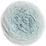 A top-down view of a single ball of fluffy, chunky yarn in a pale icy blue color, isolated on a white background.