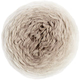 A top-down view of a large ball of chunky, curly yarn in a soft, multi-toned oatmeal beige color, isolated on a white background.