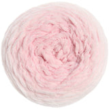 A top-down view of a fluffy, chunky circular skein of yarn in a soft light pink color, isolated on a white background.