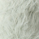A close-up texture shot of fluffy faux fur fabric in a very light off-white color.