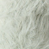 A close-up texture shot of fluffy faux fur fabric in a very light off-white color.
