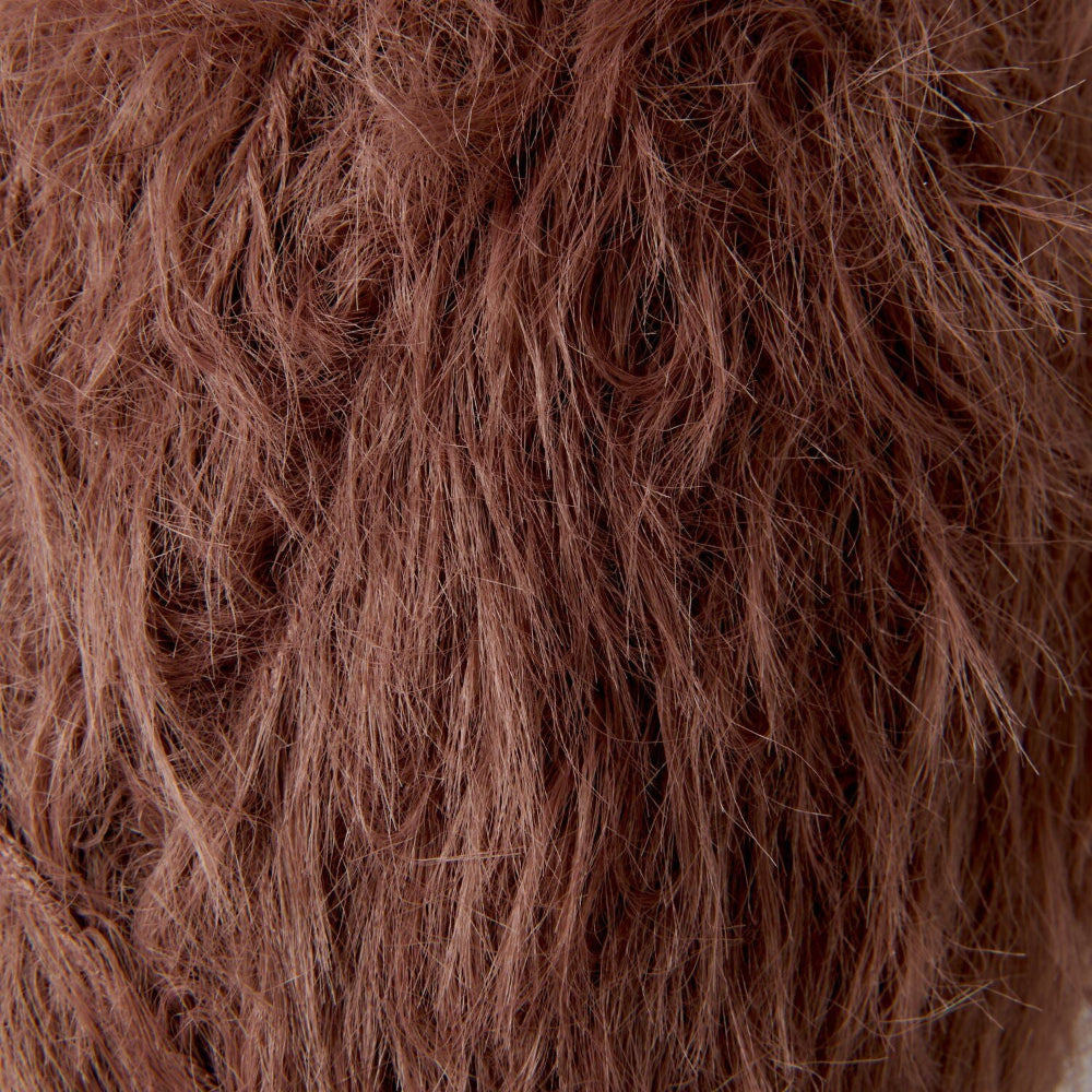 Close-up texture of shaggy, wavy hair in a warm medium brown color.