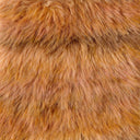A close-up texture shot of shaggy faux fur fabric in a warm golden-brown color.