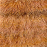 A close-up texture shot of shaggy faux fur fabric in a warm golden-brown color.