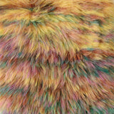Close-up of a fluffy faux fur fabric with a multicolor blend of yellow, pink, orange, and teal.
