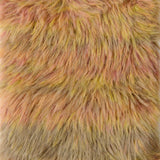 Close-up of a shaggy faux fur fabric with a variegated color pattern of pink, yellow, and beige.
