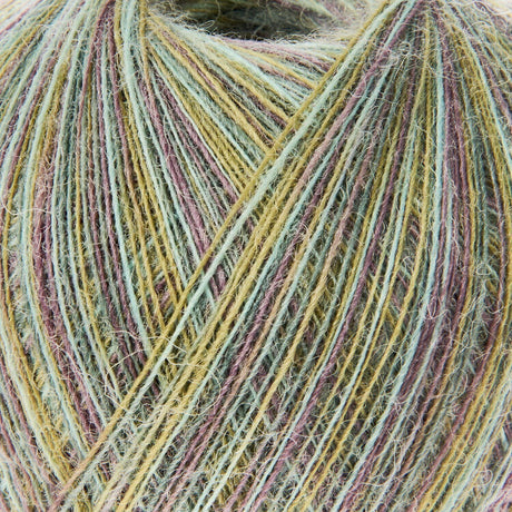 Close-up of a ball of fuzzy yarn with variegated strands in pale green, mustard yellow, dusty pink, and taupe.