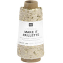 A spool of Rico Design Creative Make It Paillelette craft thread, featuring a white paper label with black text and a brown cardboard core, set against a plain white background.