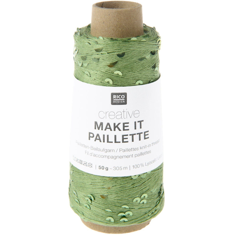 A spool of green decorative twine with a white paper label that reads 'RICO DESIGN creative MAKE IT PAILLETTRE'. The twine has a textured, slightly shiny finish with small green leaf-like accents.