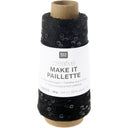 A spool of black knitted thread labeled 'RICO DESIGN creative MAKE IT PAILLETTE' on a white background.