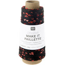 A spool of Rico Design Creative Make It Paillette thread, featuring black and red sequined thread wound around a cardboard core with a white paper label.