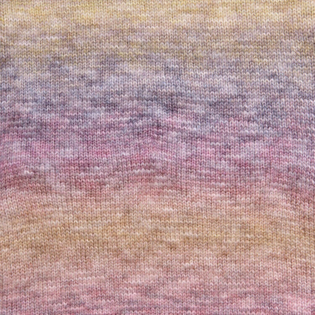 A close-up of a knitted fabric with a soft gradient pattern blending pastel yellow, lavender, pink, and peach tones.