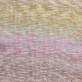 Close-up of a knitted fabric with a soft variegated color pattern transitioning from pale yellow at the top through muted green and lavender into dusty pink at the bottom.