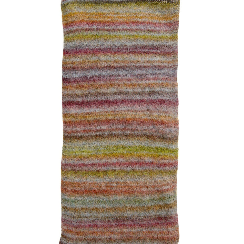 A close-up of a striped knit fabric, likely a scarf or sleeve, featuring horizontal stripes of orange, yellow, green, pink, and gray on a white background.