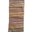 A rectangular area rug with a textured, shaggy surface featuring horizontal multicolor stripes in shades of pink, green, yellow, orange, and gray on a white background.