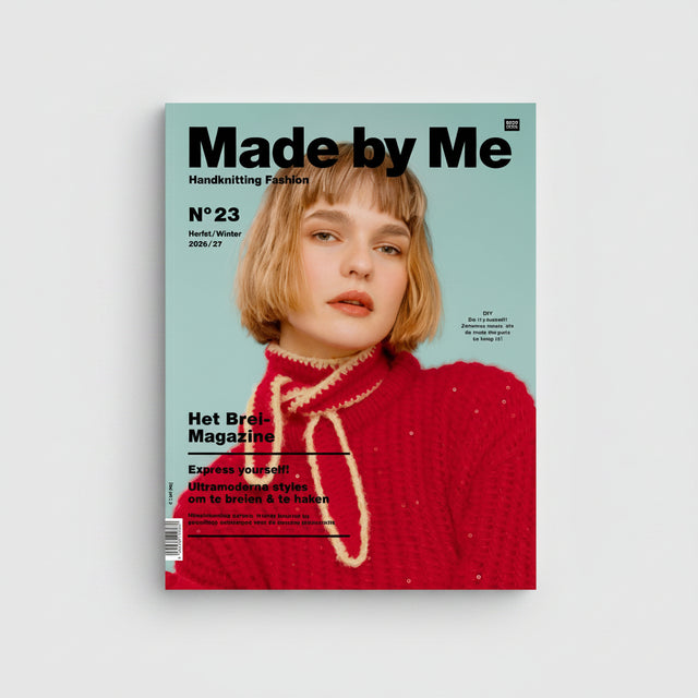 A magazine cover for Made by Me, Handknitting Fashion, issue number 23 (Winter 2023/24), featuring a woman with short blonde hair wearing a bright red knit sweater against a light blue background.