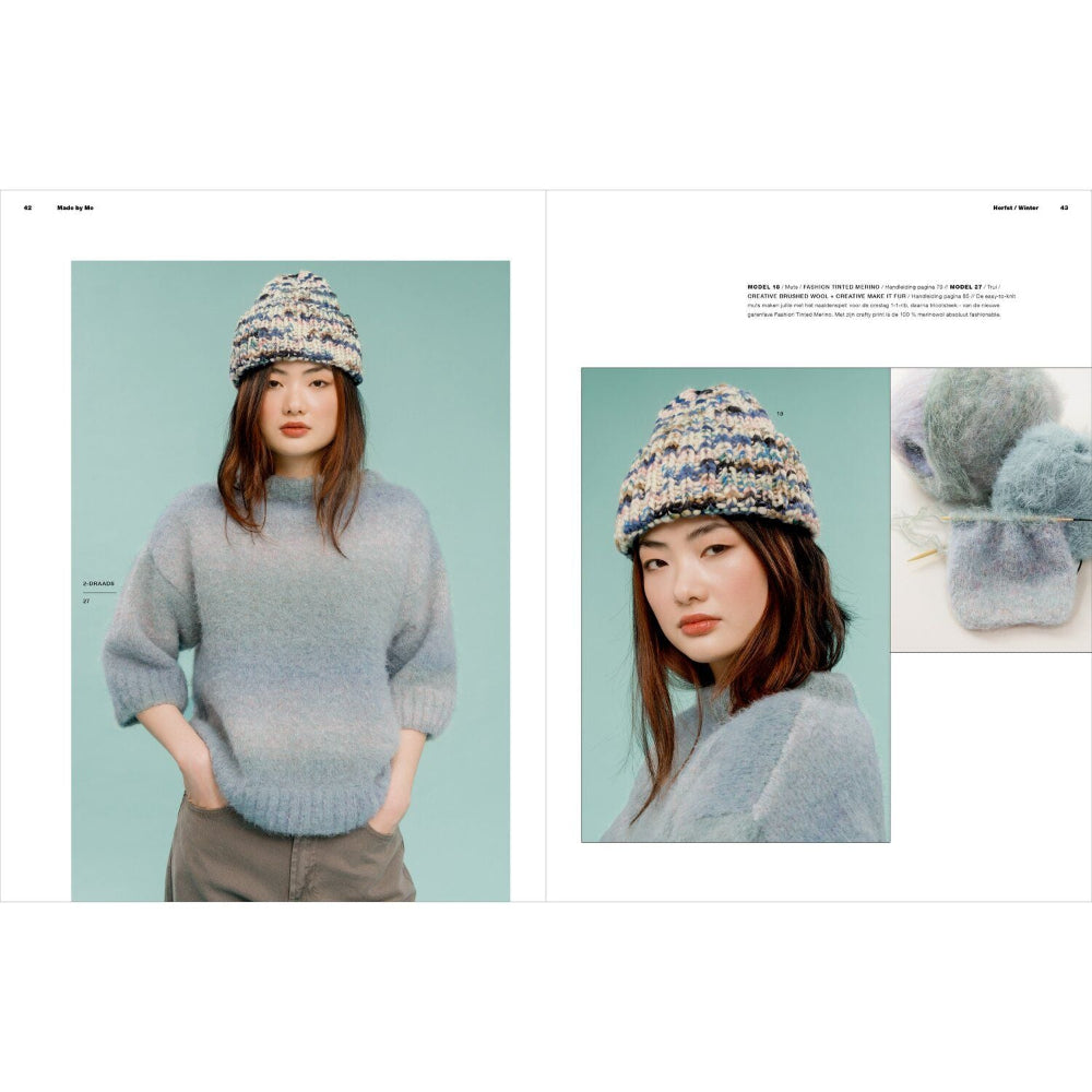 A two-page fashion catalog spread showing a model wearing a chunky knit beanie and a light blue-gray sweater against a pale aqua background. The left page features a full-body view, and the right page includes a close-up portrait, a small inset of the hat's knit texture, and a few lines of text.