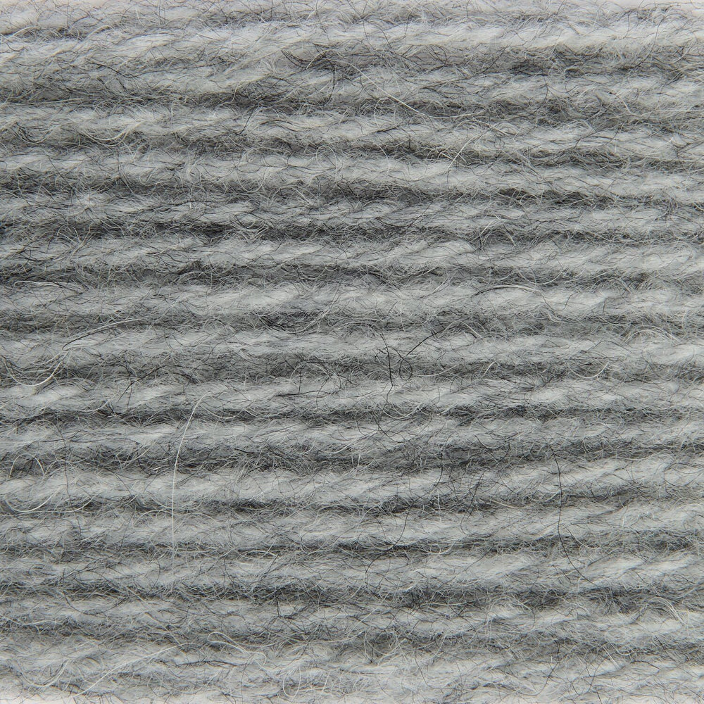 A close-up texture shot of a heathered gray and white fuzzy fabric or yarn material.