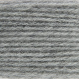 A close-up texture shot of a heathered gray and white fuzzy fabric or yarn material.