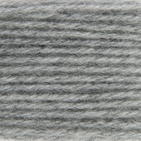 A close-up texture shot of a heathered gray and white fuzzy fabric or yarn material.