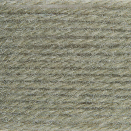 A close-up texture shot of a soft, fuzzy yarn or fleece material in a muted sage green-gray color.
