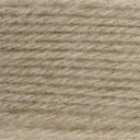 A close-up texture shot of a soft, fuzzy yarn or fleece material in a warm light beige color.