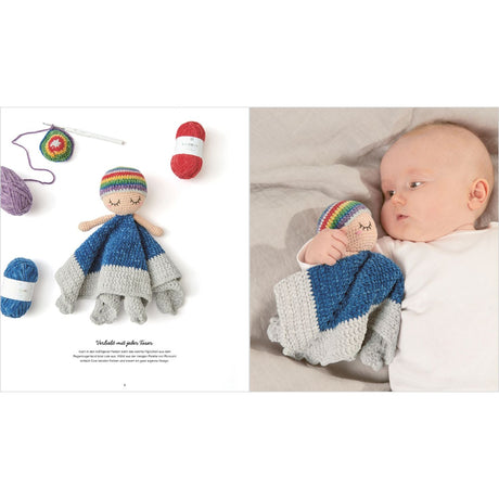 Crocheted doll with rainbow hairband and baby wearing similar outfit on a white background