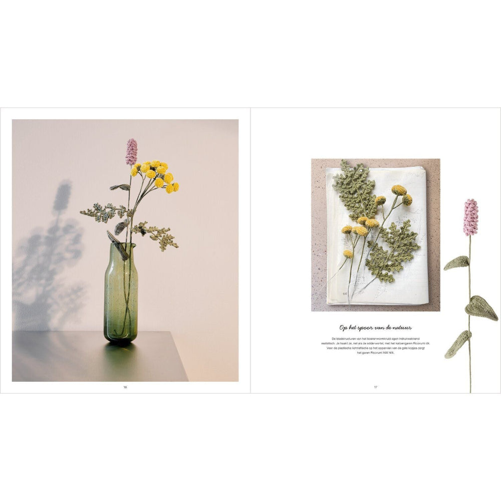 A two-page spread showing floral arrangements and crochet flowers. The left page features a green glass bottle vase with yellow flowers and green stems against a soft beige background with leaf shadows.