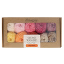 Box of Scheepjes yarn with colourful skeins and 'Stone Washed Colour Pack Manifest' label on a white background.