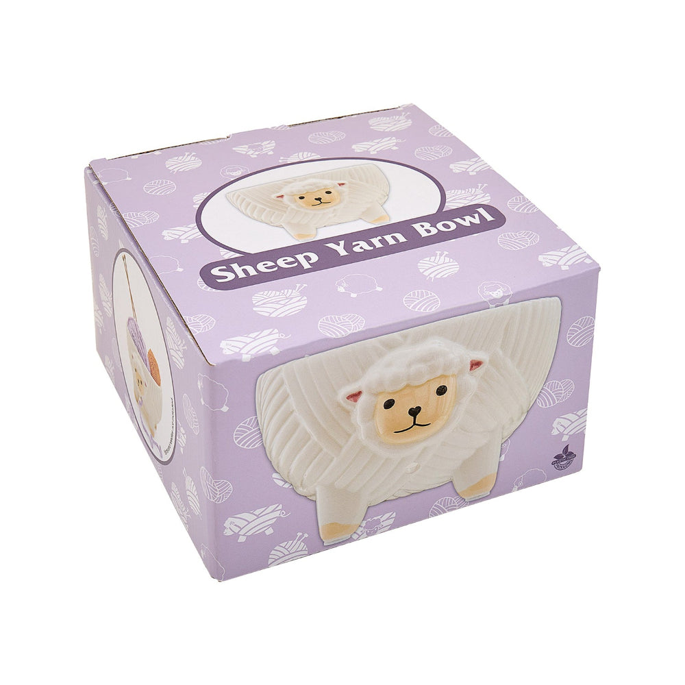 Box packaging of a sheep-shaped yarn bowl with a purple background